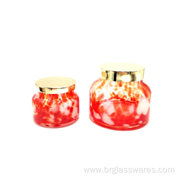 Swirled spots glass candle holder with metal lid